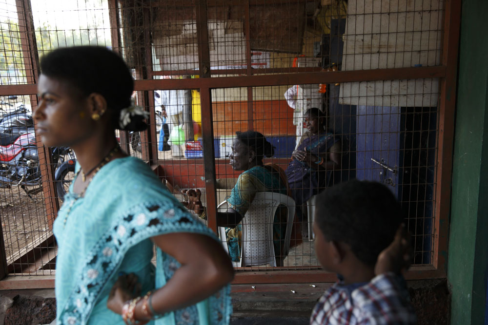 Local Sidi's wait for the afternoon bus to arrive. Uttara Kannada, India